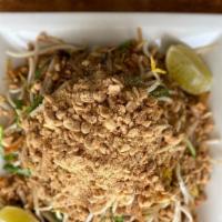 Pad Thai · Flat thin rice noodles, organic tofu, mung-bean sprouts, onion chives, dried sweet Thai radi...