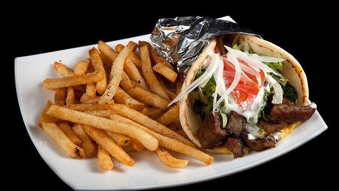 Quarantine Buster Platter · Our famous quarantine buster platter is served with Greek seasoned potato fries topped with meat or veggie falafel on your choice, side homemade hummus and Pita, and side Greek salad and our homemade garlic sauce and tzatziki sauce, feta cheese and side Pita bread.