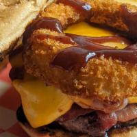The Texan Burger · Prime burger, aged cheddar, crispy onion ring, bacon, sweet BBQ.
