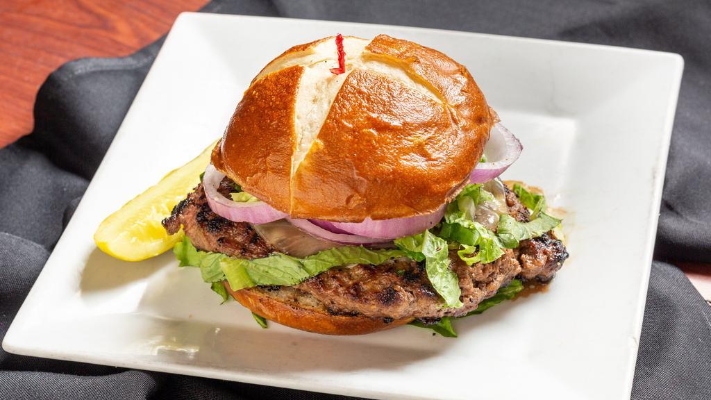 Big Boy Hamburger · Flamed-grilled eight ounces angus steak burger, served with fresh lettuce, tomatoes, red onions, mayonnaise, and melted cheese.