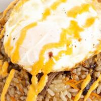 Oxtail Fried Rice · fried rice w/ pulled oxtail, carrots & scallions, topped w/ fried egg & spicy mayo.