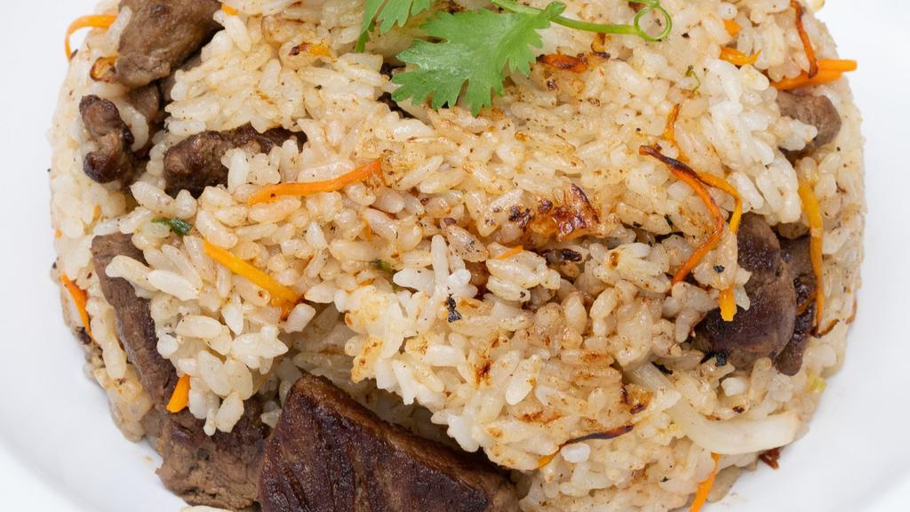 Steak Fried Rice · stir fried w/ carrots, scallions, onions & in our lemongrass sauce