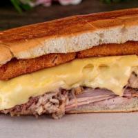 Croqueta Preparada Sandwich · If you ever wished for croquetas in a sandwich, try this one! Ham, swiss cheese, and roasted...
