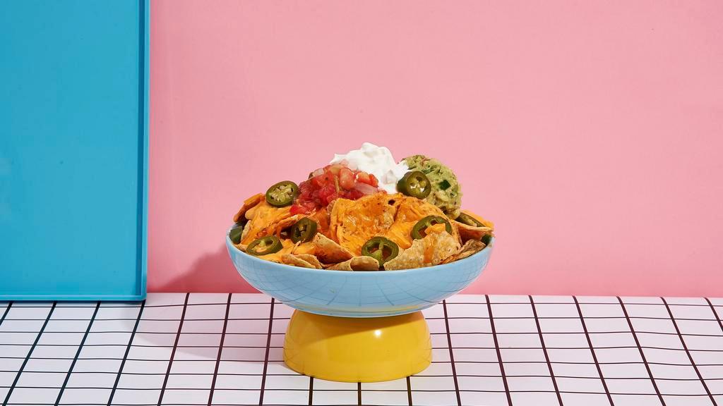 Loaded Nachos · Fried tortilla chips with shredded melted cheese,  beans, pico de gallo, jalapenos, sour cream, and guacamole