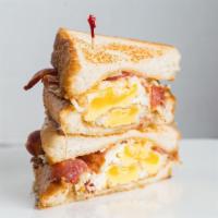The Basic Breakfast · Fried egg, bacon, Asiago cheese, Texas toast.