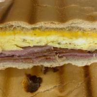 Cuban Breakfast Sandwich · Two scrambled eggs, ham and cheese, buttered cuban toast