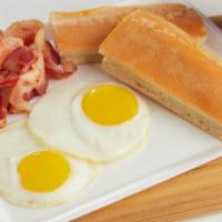 Breakfast Special · Huevo, bacon o jamon, tostada,cafe con leche. Two eggs, ham or bacon, Cuban toast and small ...