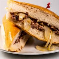 Pan Con Lechon · Pulled roasted pork and onions on Cuban bread.