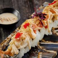 Sushi Gratinado · Crispy shrimp avocado and cream cheese covered with gratin crab and acevichado sauce .