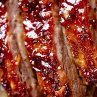 Bbq Rib  Dinner · 1/4 rack fall off the bone Rib, with 2 sides. Your choice of : Baked Mac & Cheese,  Green Be...