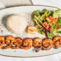 Grilled Shrimp · Marinated succulent wild tiger shrimp grilled, served with field greens and basmati rice.