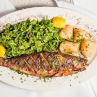 Grilled Whole Seabass · Grilled wild caught Mediterranean seabass served with Greek potatoes, capers, and arugulasal...