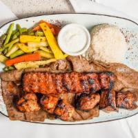 Mixed Grilled Kebabs · Half portions of shish kebab, doner kebab, chicken kebab and adana kebab; served with sauted...