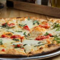Margarita Pizza · Plum tomatoes, fresh mozzarella, and fresh basil.