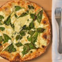 Green Goddess Pizza · Ricotta, spinach, roasted garlic, and mozzarella.