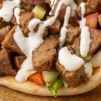 Lamb · Comes in pita bread with red onion, feta cheese, lettuce, tomato & french fries