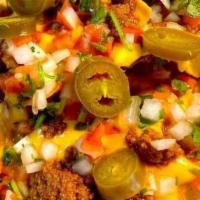 Chili Con Queso  · Mexican corn chips topped with melted cheddar cheese topped with homemade salsa, jalapeños a...
