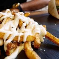 Truffle Fries  · Classic seasoned hand cut fries topped with truffle oil, truffle mayo, fresh herbs and Parme...