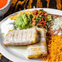 Chimichanga · Two stuffed flour tortillas with your choice of chunks of beef or chicken, deep-fried to a g...