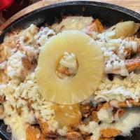 Flamin' Hawaiian · Grilled chicken on a hot skillet topped with melted shredded cheese, grilled pineapple, a Me...