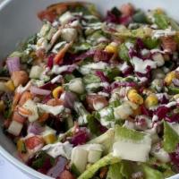 House Salad · Vegan. Lettuce, tomato, cucumber, red cabbage, onion, carrot, cilantro, corn, chickpeas, tah...