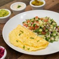 Israeli Breakfast · 3 eggs Omelette, Israeli Chopped salad,sides of: Tahini, Feta Cheese, olives, red cabbage, p...