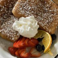 French Toast · Two slices of Brioche bread, hand-dipped in real egg batter, milk, vanilla and cinnamon then...