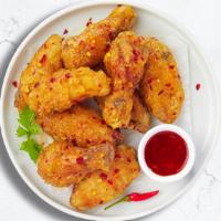 Ironic Sweet Chili Wings · Fresh chicken wings fried until golden brown, and tossed in sweet chili sauce.