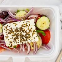 Greek Salad · Most popular. Tomatoes, cucumbers, green peppers, onions, Feta, extra virgin olive oil, oreg...