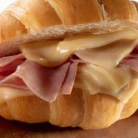 Croissant Jamon Y Queso · Croissant with ham and cheese.