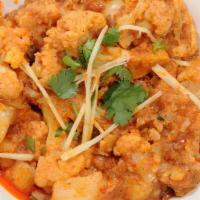 Aaloo Gobi · Cauliflower and potato cooked in spices flavored with ginger . Served with  1 side dish