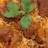 Mutton Biryani · Goat bone in meat marinated flavored with spices cooked with basmati rice. It is served with...