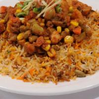 Vegetable Biryani · Mixed vegetable cooked with basmati rice and exotic spices. It is served with raita.
