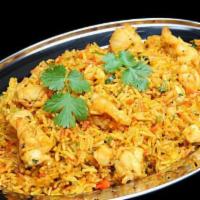 Shrimp Biryani · Shrimp marinated flavored with spices cooked with basmati rice. It is served with raita.