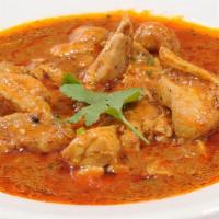 Chicken Korma · Boneless chicken is cooked in an onion and tomato based sauce and spices. Served with 1 side...