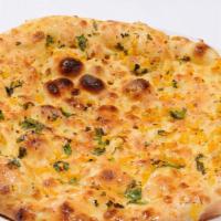 Garlic Naan · White flat bread Flavored with fresh minced garlic and baked in clay oven.