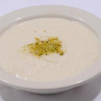 Kheer · Basmati Rice Cooked in milk and sugar. Flavored with green cardamom, pistachios and almonds.