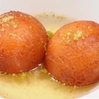 Gulab Jaman (3 Pus) · Milk solid balls dipped in sugar syrup.