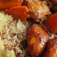 Brown Stew Chicken · Served with fried plantains, veggies, and white rice or rice and peas.