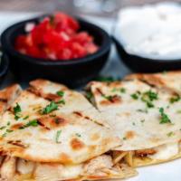 Quesadilla · Tortilla filled with chicken, cheese, sour cream. Served with side of Guacamole, Pico de Gal...