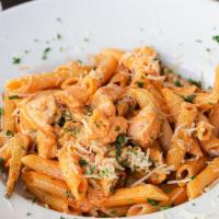 Penne Salmon A La Vodka · Fresh Atlantic salmon, seasoned zucchini, tomato, marinated with cream sauce