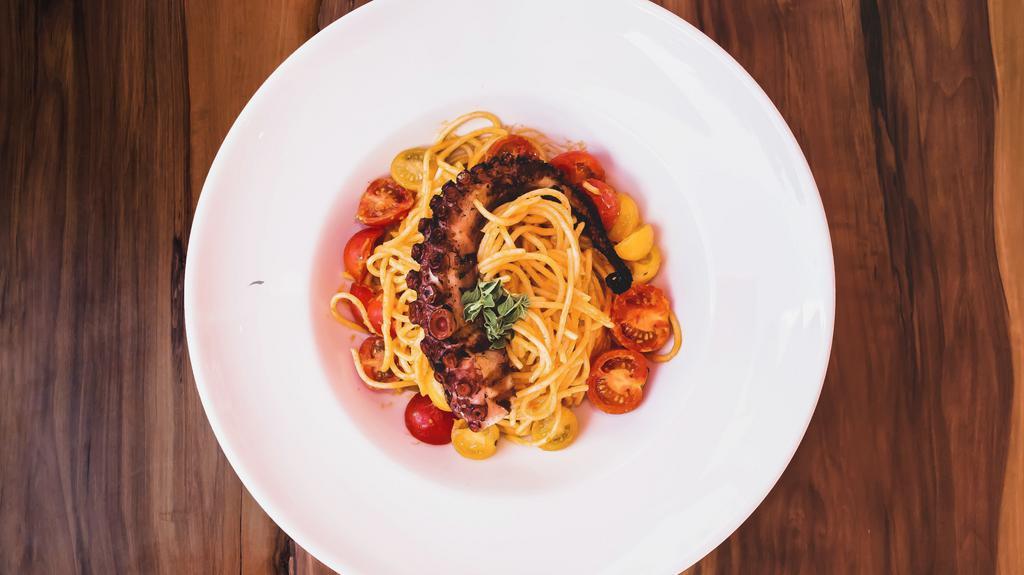 Spaghetti And Octopus · Spanish octopus, homemade spaghetti pasta in a classic Italian tomato sauce with cherry tomatoes