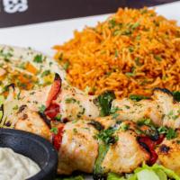 Chicken Skewers · Chicken skewers, Served with 7 spices rice, hummus, pita bread and garlic sauce