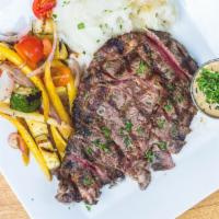 Ribeye Steak · Grilled rib-eye served with mashed potatoes, veggies and mushroom sauce