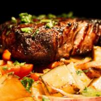 Fillet Mignon · Grilled beef tenderloin, roasted potatoes, and eggplants, served with demi-glace sauce.
