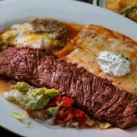 Carne Asada A La Tampiquena · A foot long Angus skirt steak charbroiled to taste accompanied with two cheese enchiladas su...