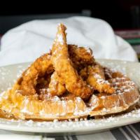Chicken & Waffle · Belgian waffle, fried chicken tenders, melted butter, powdered sugar, maple syrup.
