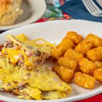 Meatlover'S Omelette · Three Eggs with Bacon, Sausage, Ham and Choice of Cheese