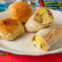 Steak Bomb Burrito · Three scrambled eggs, shaved steak, cheese, onions and tater tots all wrapped in a jumbo flo...