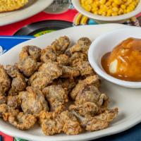 Chicken Gizzards  · Stewed Until Tender then Southern Fried Crispy. Served with Two Sides & Bread